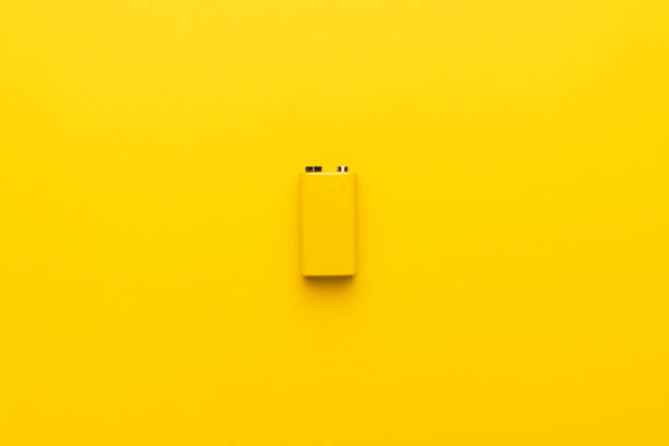 istock Blank nine-volt battery on the yellow background 2182070460