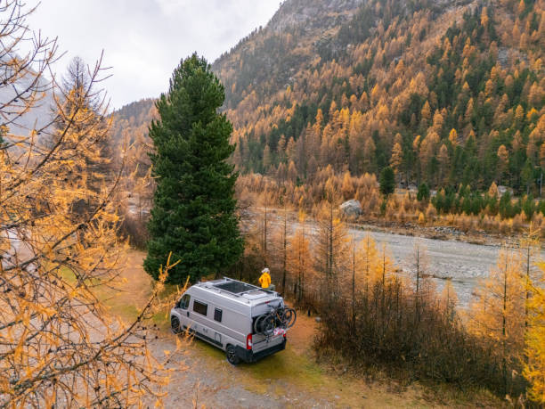 Campervan Traveler Admiring Autumn Mountain Scenery