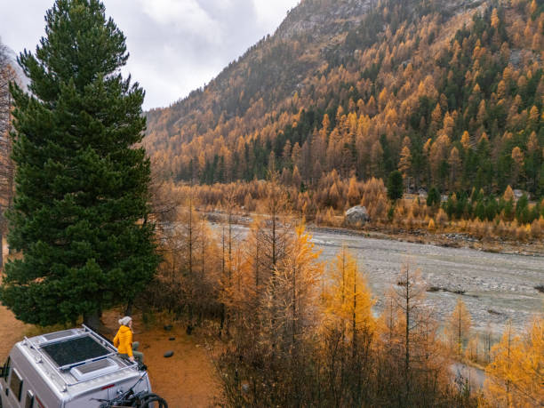 istock Campervan Traveler Admiring Autumn Mountain Scenery 2182070783