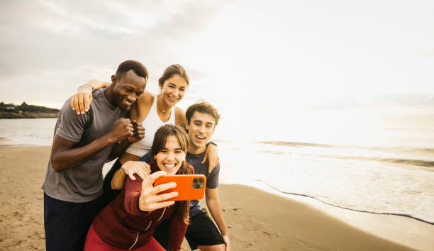 istock Friends enjoying a beach day selfie by the ocean. 2182071341
