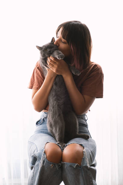 istock Young Woman And Cat 2182072923