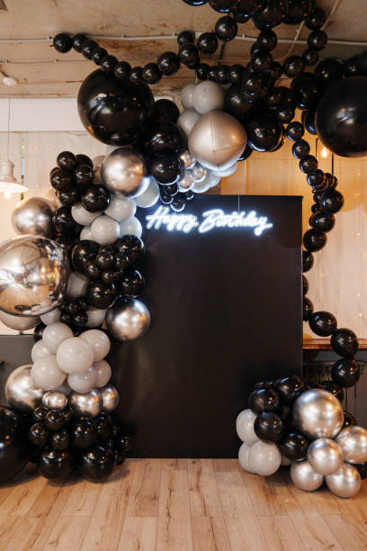 istock Festive birthday decor with silver and black balloons 2182073095