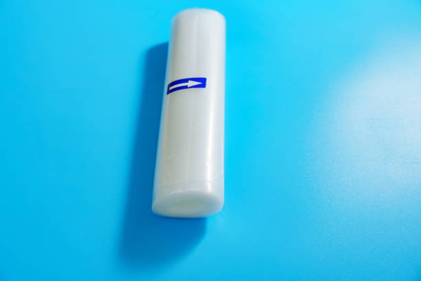 istock Roll film for a product vacuum sealer machine on a blue background. 2182075575