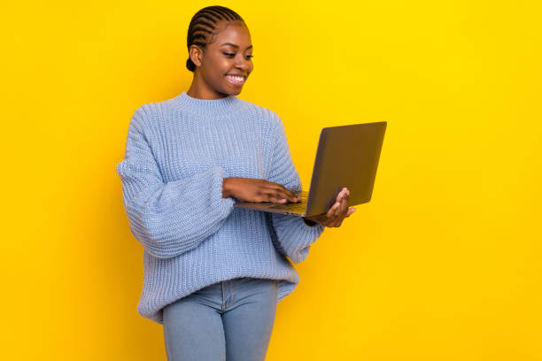 istock Photo of young lady programmer freelance working using new laptop smiling isolated on bright yellow color background 2182076673