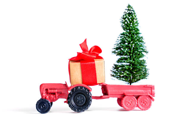 istock Festive Red Tractor with Christmas Tree and Gift Box Decoration 2182078038