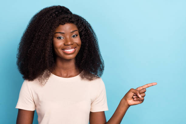 istock Portrait of pretty friendly lady indicate finger empty space ad proposition isolated on blue color background 2182078890