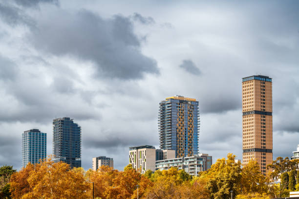 High rise hotels and student accommodation and apartment buildings in Adelaide city viewed from the Riverbank during autumn season