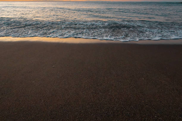 beautiful sunrise on the sea with white waves