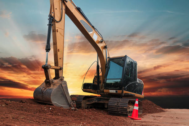 istock Yellow  Excavators are digging the soil in the construction site 2182080355