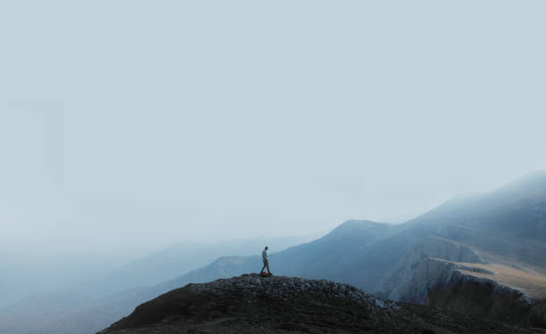 istock Lonely hiker on the mountain peak 2182082845