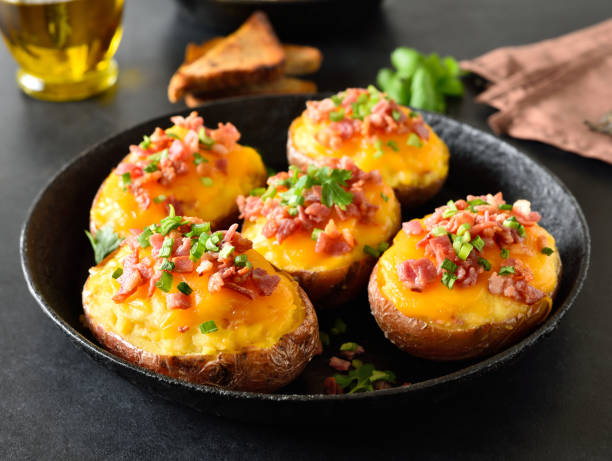 istock Baked stuffed potatoes with bacon, green onion and cheddar cheese 2182082923