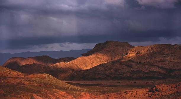 istock Sunbeam lightening parts of mountain range. 2182086579