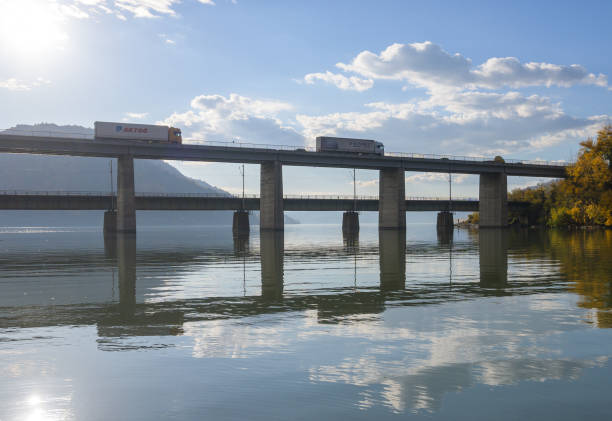 Trucks on the bridge, at height. Romania, Mehedinti. October, 30, 2024