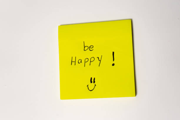 istock Yellow sticky note with words Be happy on white background 2182089844