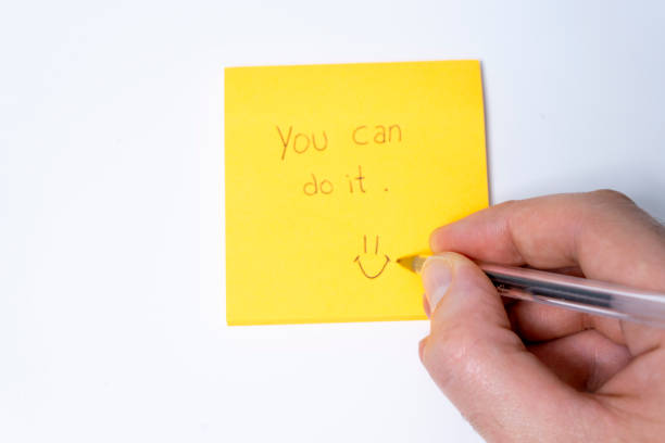 istock You can do it, hand writing on yellow sticky note isolated on white 2182089907