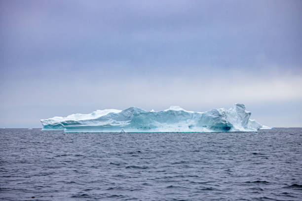Huge iceberg floating outside the famous Ice Fjord outside Ilulissat in western Greenland which is an UNESCO World Heritage Site due to the Ice Fjord