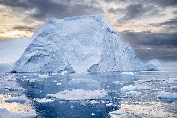 istock Iceberg floating on a fjord in a late afternoon 2182092477