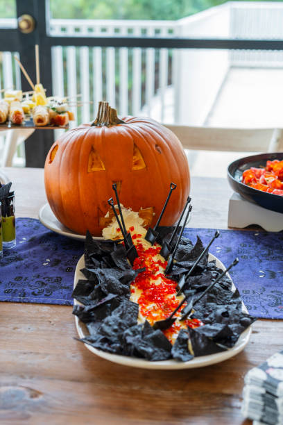 istock Halloween-themed catering served on a table at a costume party 2182092604