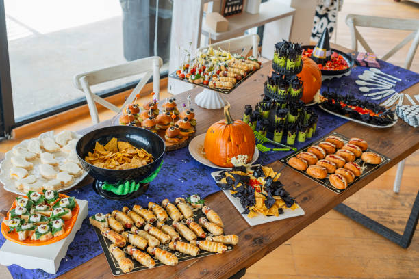istock Halloween-themed catering served on a table at a costume party 2182092788