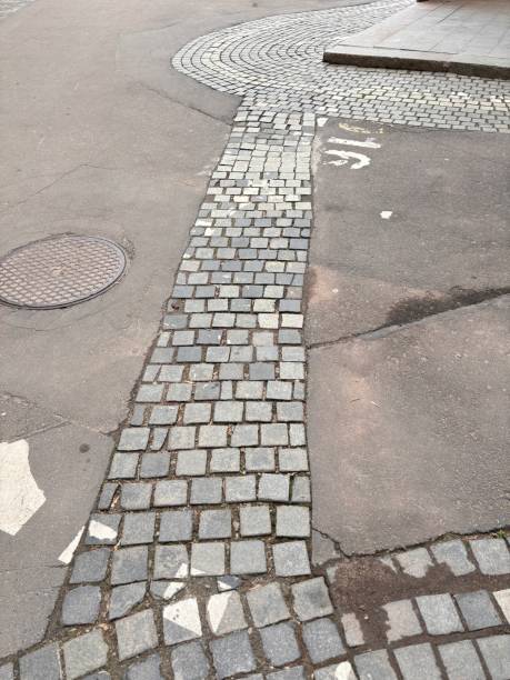 istock Part of the sidewalk with stone and asphalt 2182097172