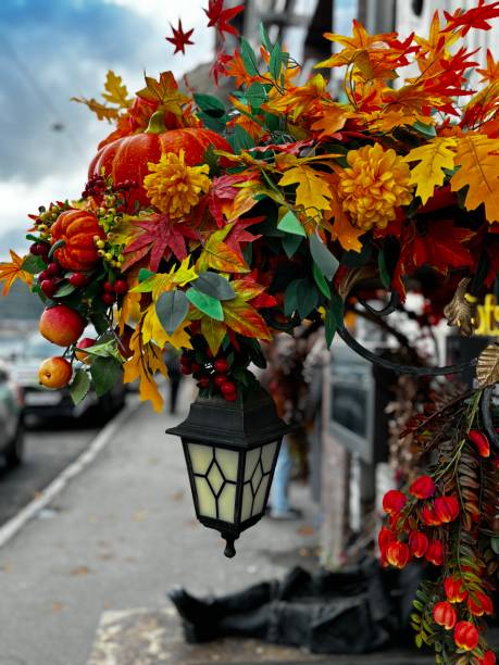 istock Autumn leaves with pumpkins and lanterns 2182097293