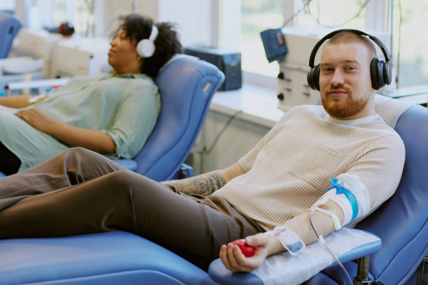 istock Donating Blood at Medical Facility with Relational Experience 2182098246