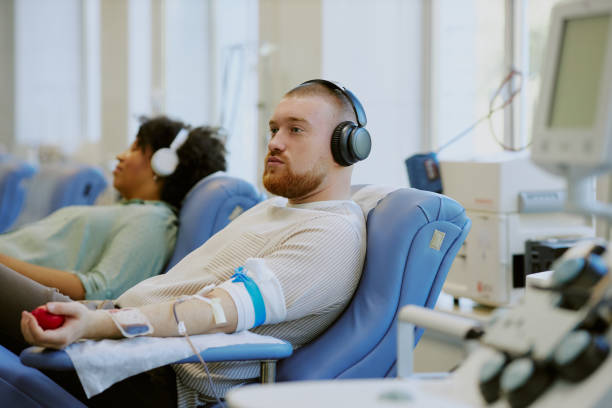 istock Donating Blood in Modern Medical Facility Using Technology 2182098600