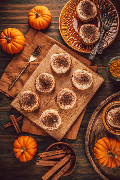 istock Homemade pumpkin muffins with cheesecake icing 2182099603
