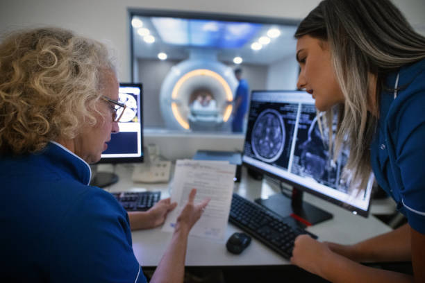 istock Female Radiologists Analyzes the MRI Images. 2182100858