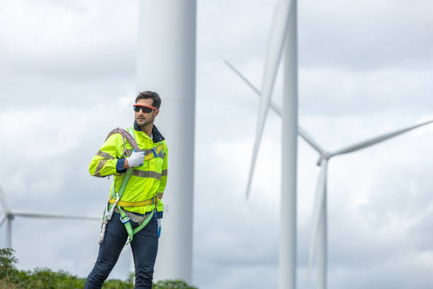 istock Man engineers holding tools box and rope to maintenance working in wind turbine. Renewable energy power wind turbine. Technology protect environment reduce global warming problems 2182104606