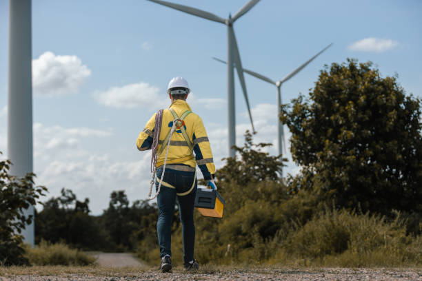istock Man engineers holding tools box and rope to maintenance working in wind turbine. Renewable energy power wind turbine. Technology protect environment reduce global warming problems. 2182104648