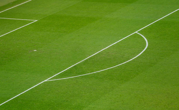 istock Football Field Geometry: White Lines on Lush Green Grass 2182106590