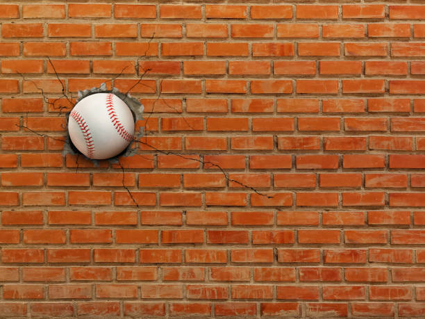 istock Baseball breaks through the wall, sports concept, strength. 2182109949