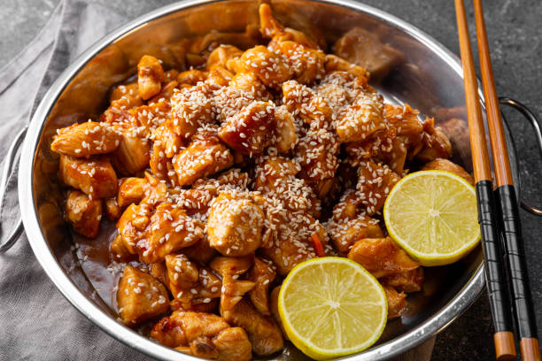 istock Asian caramelized chicken breast on dark grey background top view 2182116982