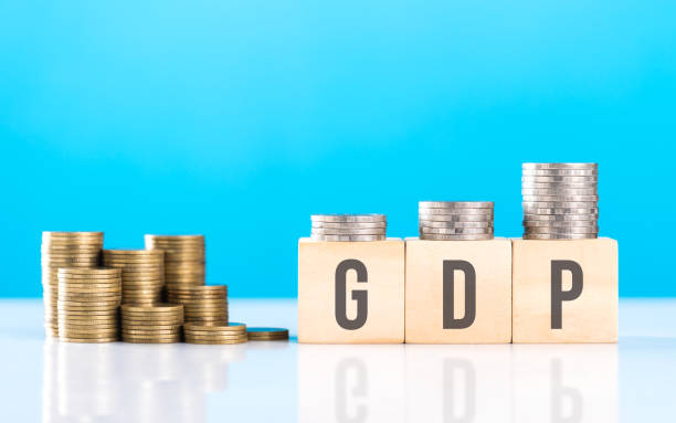 istock Wooden block labeled 'GDP' alongside a stack of coins. Symbolizes economic growth, emphasizing the significance of Gross Domestic Product in assessing financial progress and national prosperity 2182119115