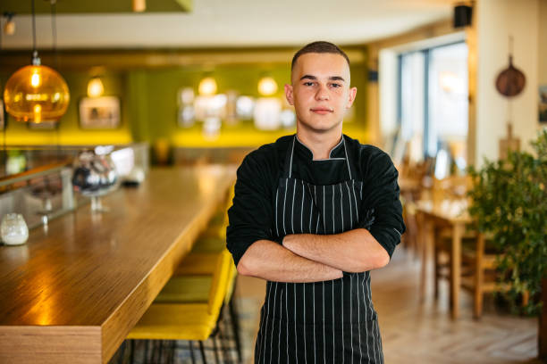 istock Young Male Chef Standing In A Restaurant Indoors 2182121945