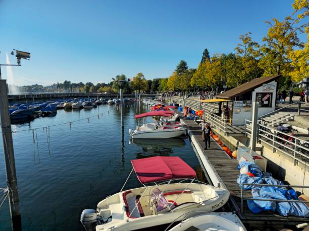 Freidrichshafen Harbor with several boats and people enjoying the beautiful weather.