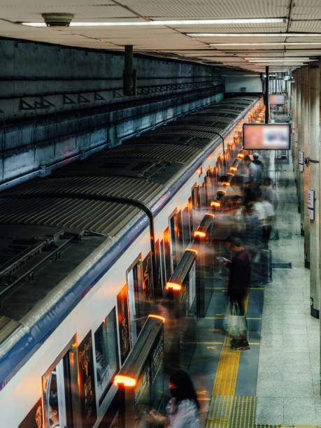 Line 2 of the Beijing Subway, Crowded Commuter people left and walk out from Subway train.