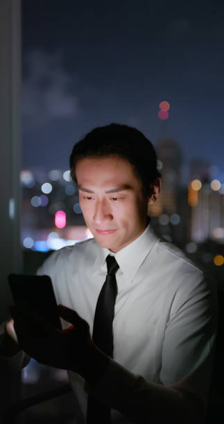 istock man use smartphone near window 2182127831