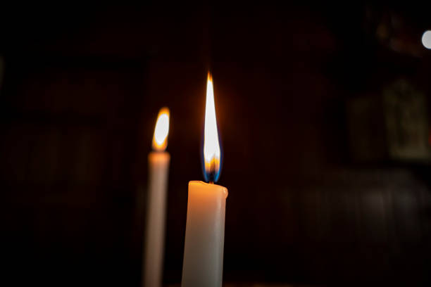 istock Candles burning in the dark 2182127986