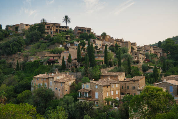 istock A hillside with houses and trees deia mallorca 2182128626