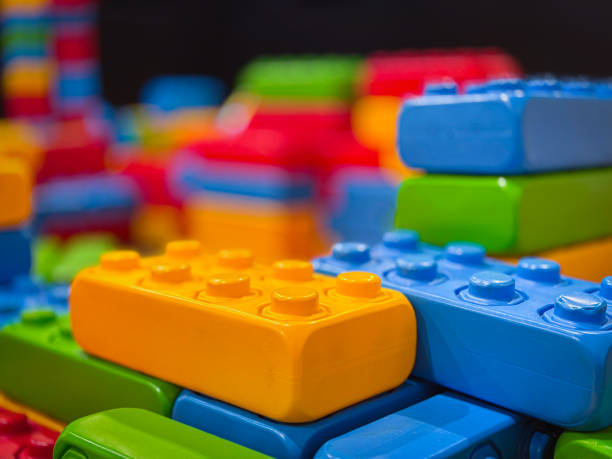 This image showcases a vibrant assortment of colorful building blocks, meticulously stacked and arranged in an array of hues.