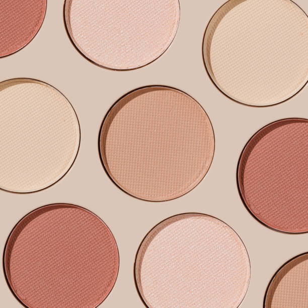 istock Colorful Swatches eyeshadow refills as minimal geometric pattern. Matte and glitter pans red brown pink shade with sun shadows, detail texture, cosmetic, beauty product, makeup, warm color scheme 2182135319