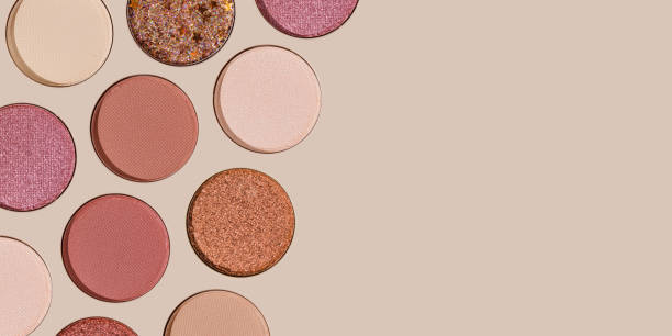 istock Colored Swatches eyeshadow refills as minimal geometric pattern, banner with copy space. Matte and glitter pans red, brown, pink, purple shade, detailed texture, cosmetic, beauty product, make up 2182135323