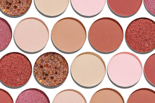 istock Cosmetics texture pattern, Warm vivid colored eye shadow makeup palette, round eye powder swatches. Female cosmetic and beauty products, aesthetic minimal beauty photo, colorful eyeshade, top view 2182135324