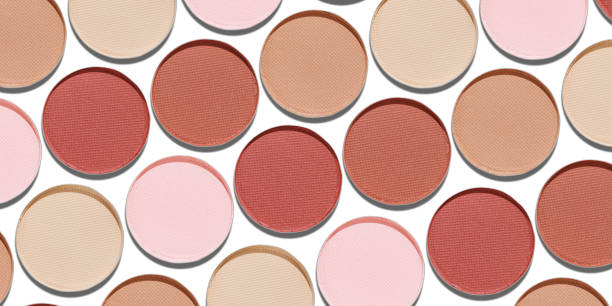 istock Swatches eyeshadow refills as minimal graphic pattern on white. Pastel matte pans brown beige nude shades with sun shadows, detailed texture, cosmetic, beauty concept makeup, top view banner 2182135331