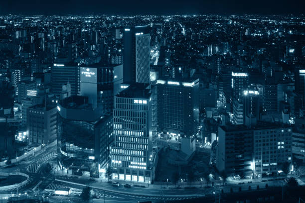 Nagoya Japan city skyline at night, processed with a blue tone.