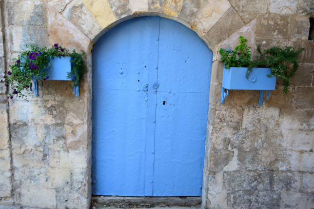 Blue door and historic stone building