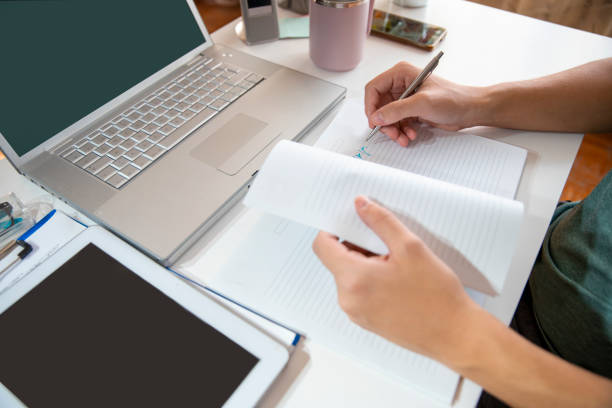 istock Writing new goals for his work and life 2182138235