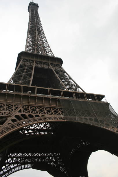 istock Eiffel Tower in Paris France standing underneath looking up. 2182140639